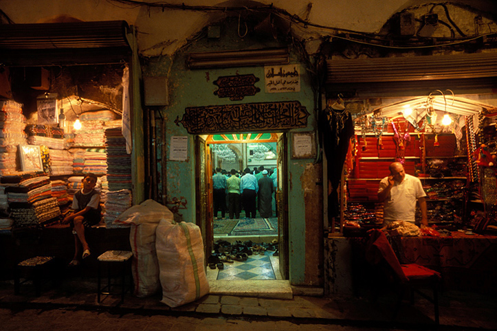 Syria. Aleppo. Prayer in souq